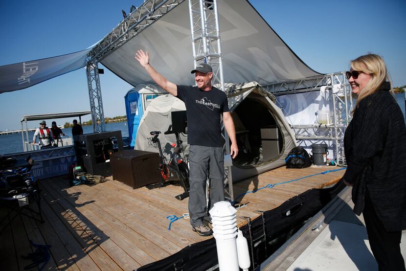 Todd Phillips, founder and director of The Last Well, waves  before stepping onto the dock...