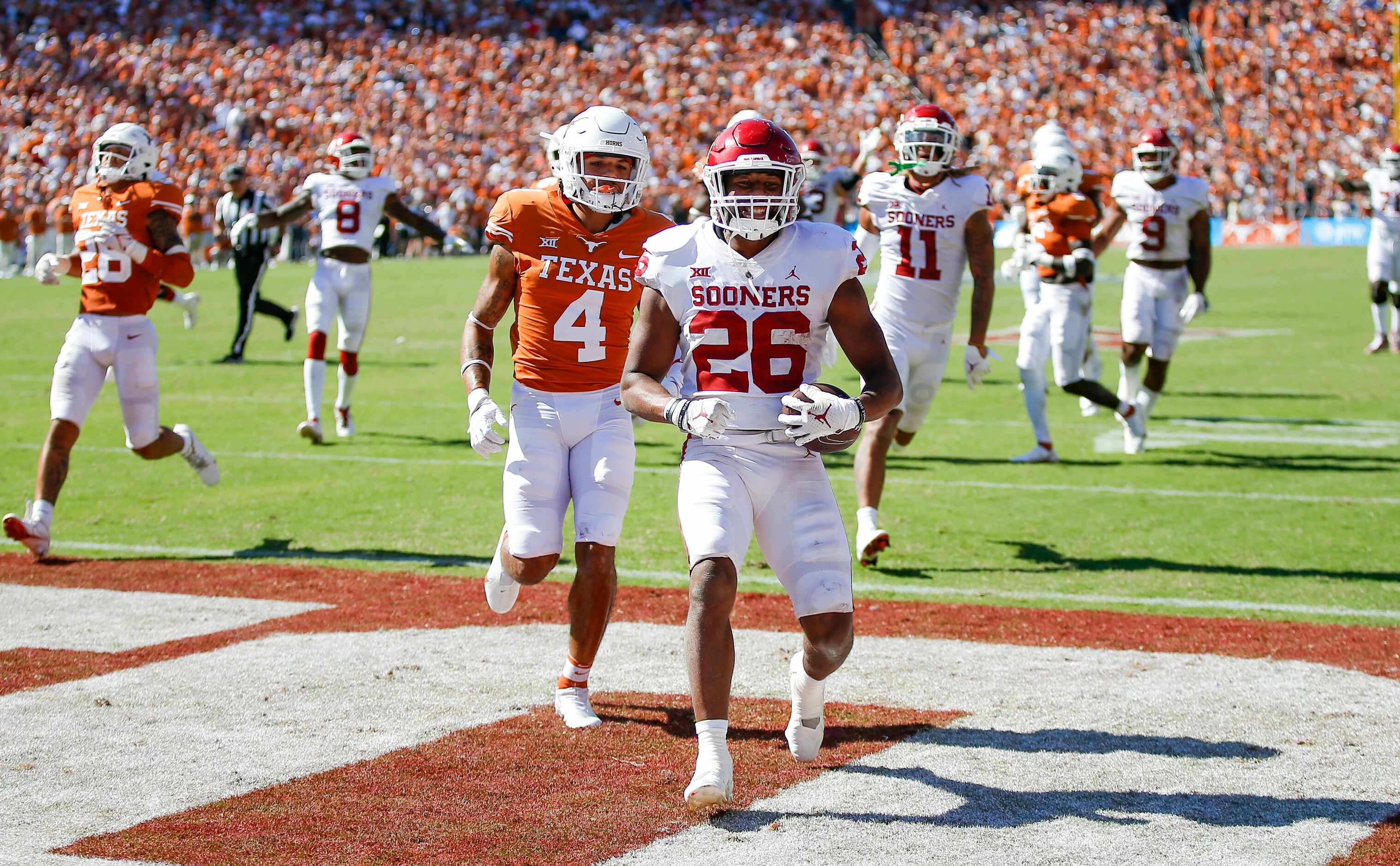 Oklahoma running back Kennedy Brooks (26) scores the game winning touchdown with three...