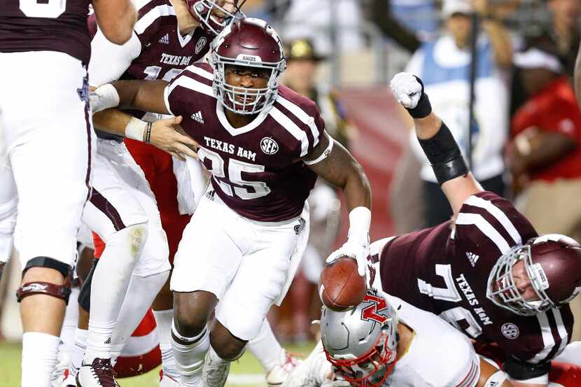 Texas A&M Aggies running back Kendall Bussey (25) comes up with a fourth quarter touchdown...