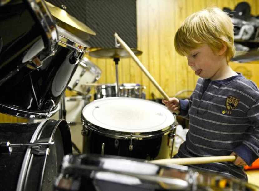 
Pearson Cates, 3, plays the drums shortly after his lesson at the Norris Family Music store...