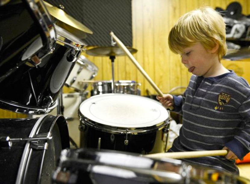 
Pearson Cates, 3, plays the drums shortly after his lesson at the Norris Family Music store...