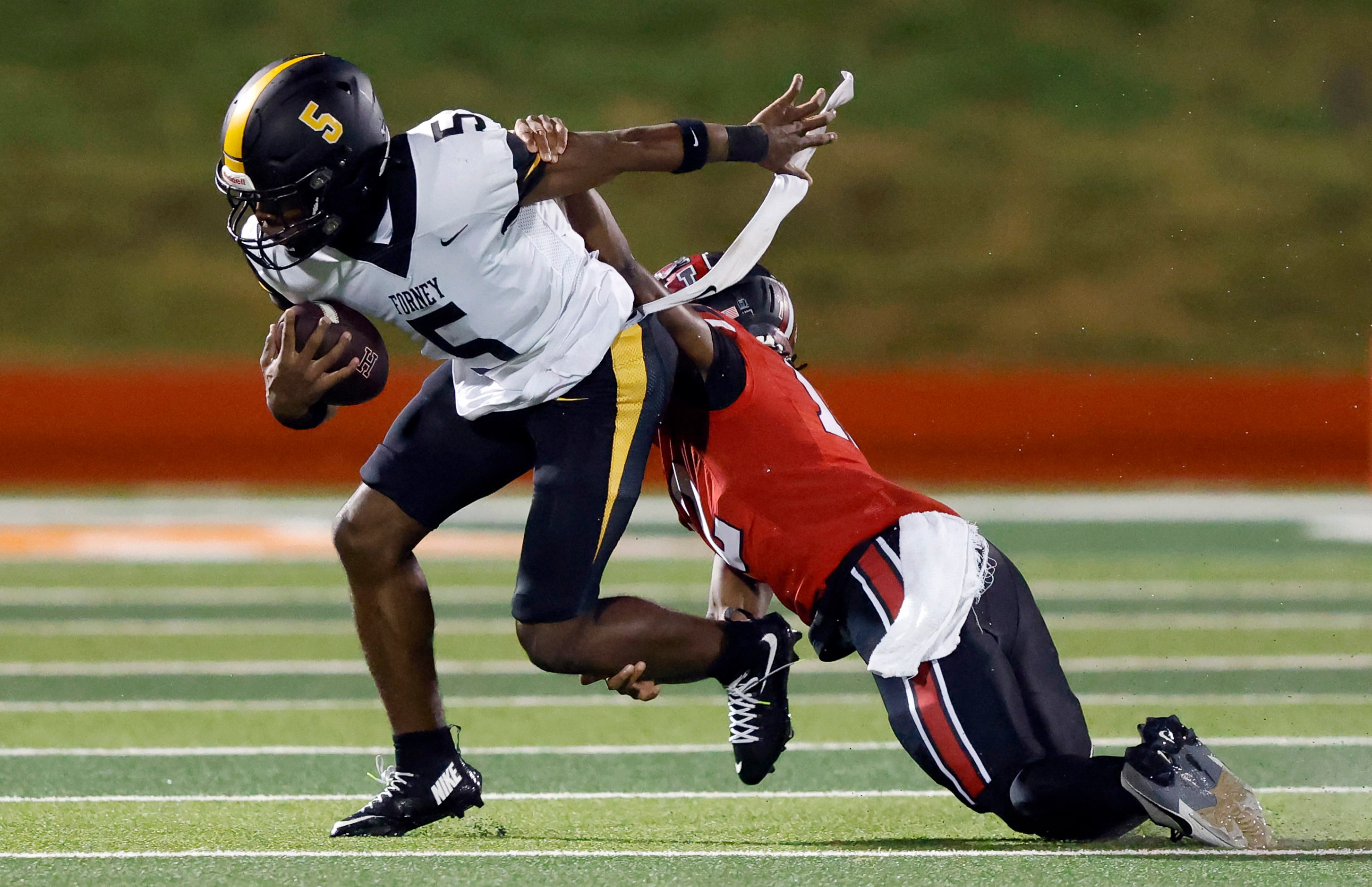 Forney defensive back Cadon Webb (5) intercepts a deep pass intended for Rockwall-Heath wide...