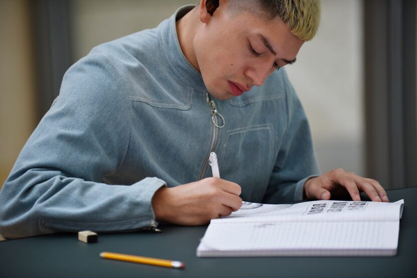 Edgar Silva, 27, a Dallas fashion designer, sketches an eyeball as a way to express himself...