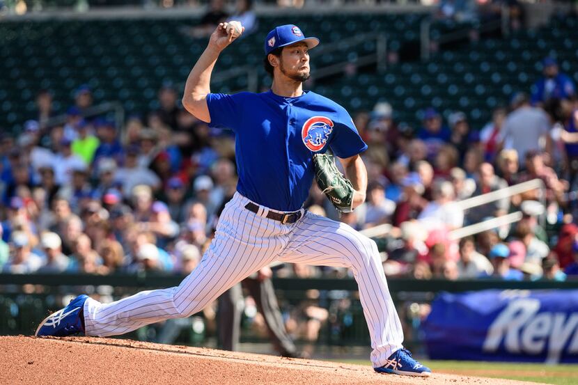 MESA, ARIZONA - FEBRUARY 26: Yu Darvish #11 of the Chicago Cubs delivers a pitch in the...