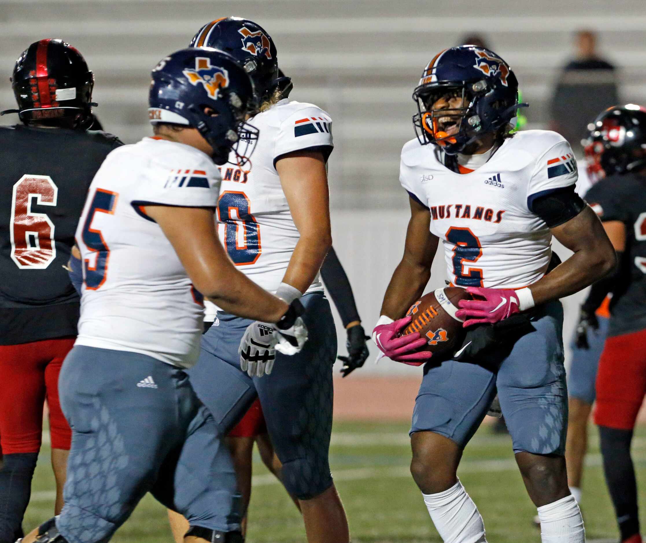 Sachse RB Pope Akanna (2) and teammate Kalig Lockett (5) are all smiles after another...