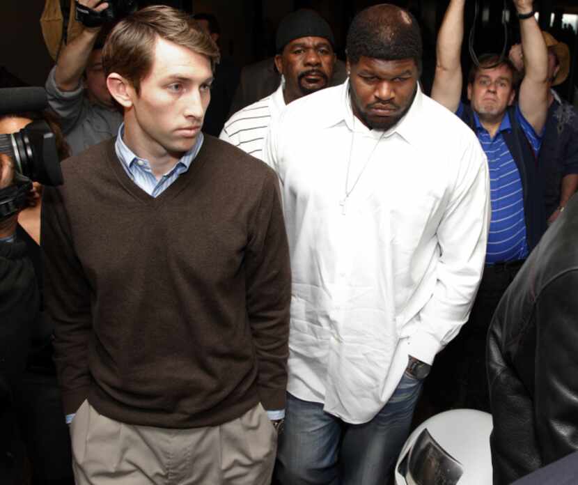 Josh Brent (right) leaves the Dallas County 195th District Court after a bond reduction...