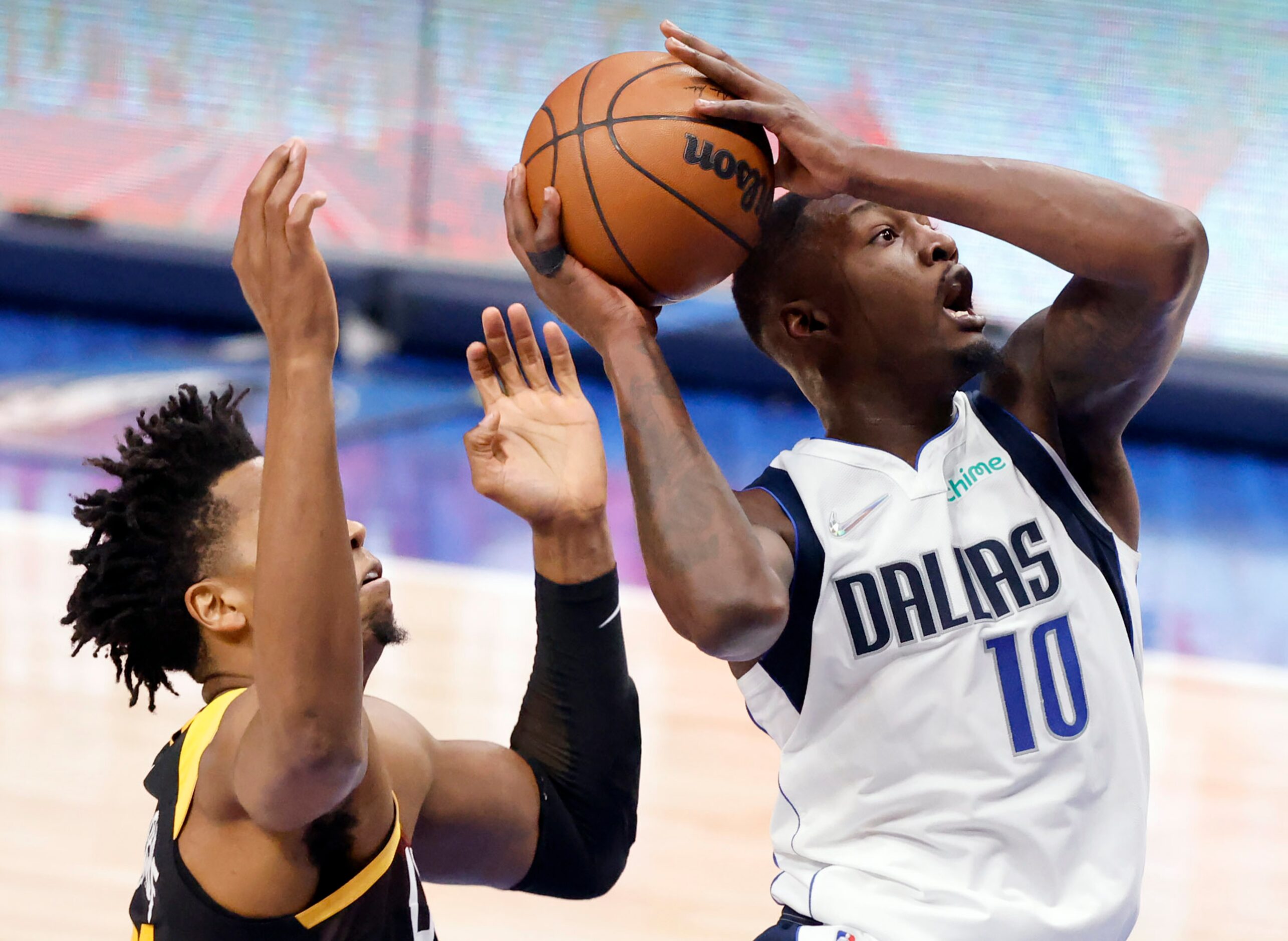 Dallas Mavericks forward Dorian Finney-Smith (10) puts up a first half shot against Utah...