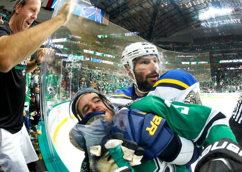 St. Louis Blues right wing Troy Brouwer (36) wraps up Dallas Stars defenseman Alex Goligoski...