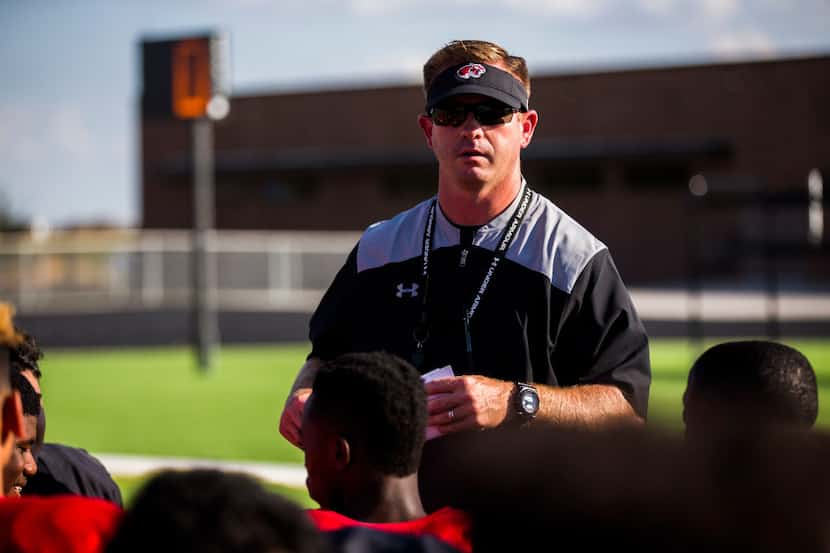 FILE - Denton Braswell head coach Cody Moore talks to his team after a practice on Tuesday,...