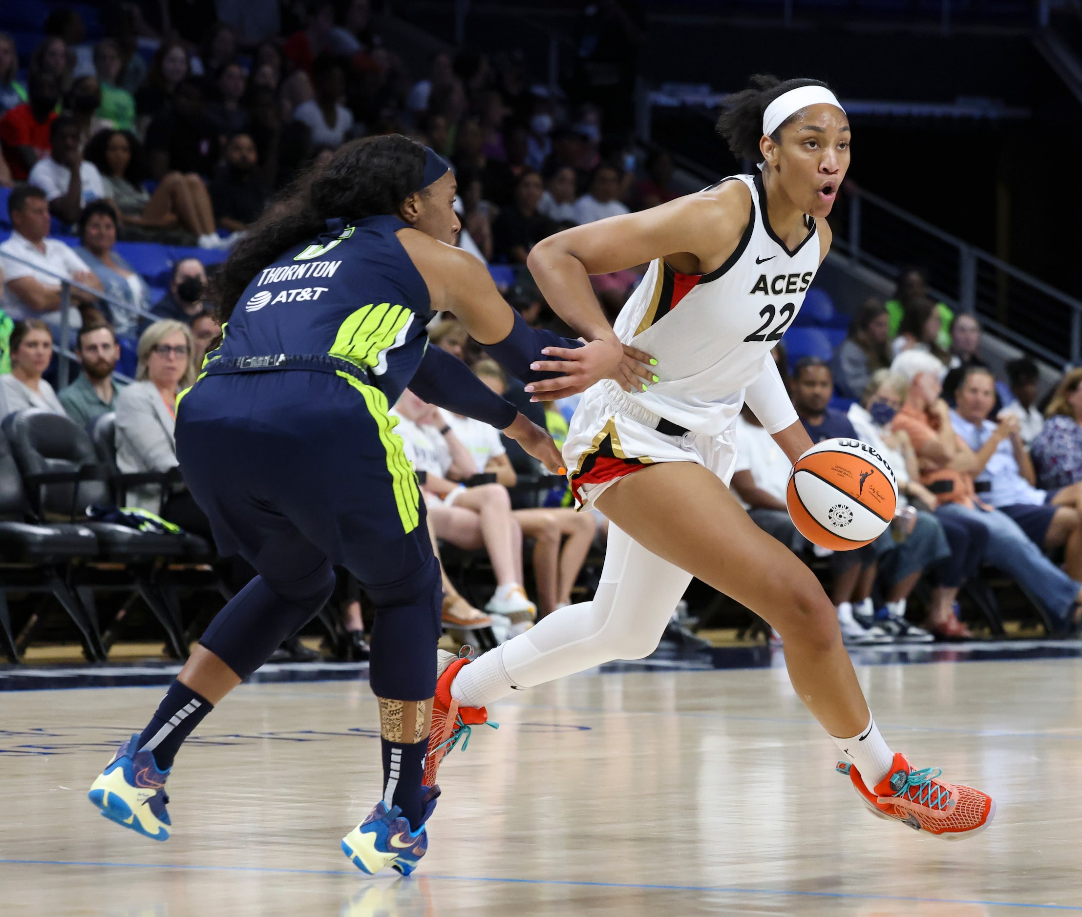 Dallas Wings forward Kayla Thornton (6) defends Las Vegas Aces forward A'ja Wilson (22) as...