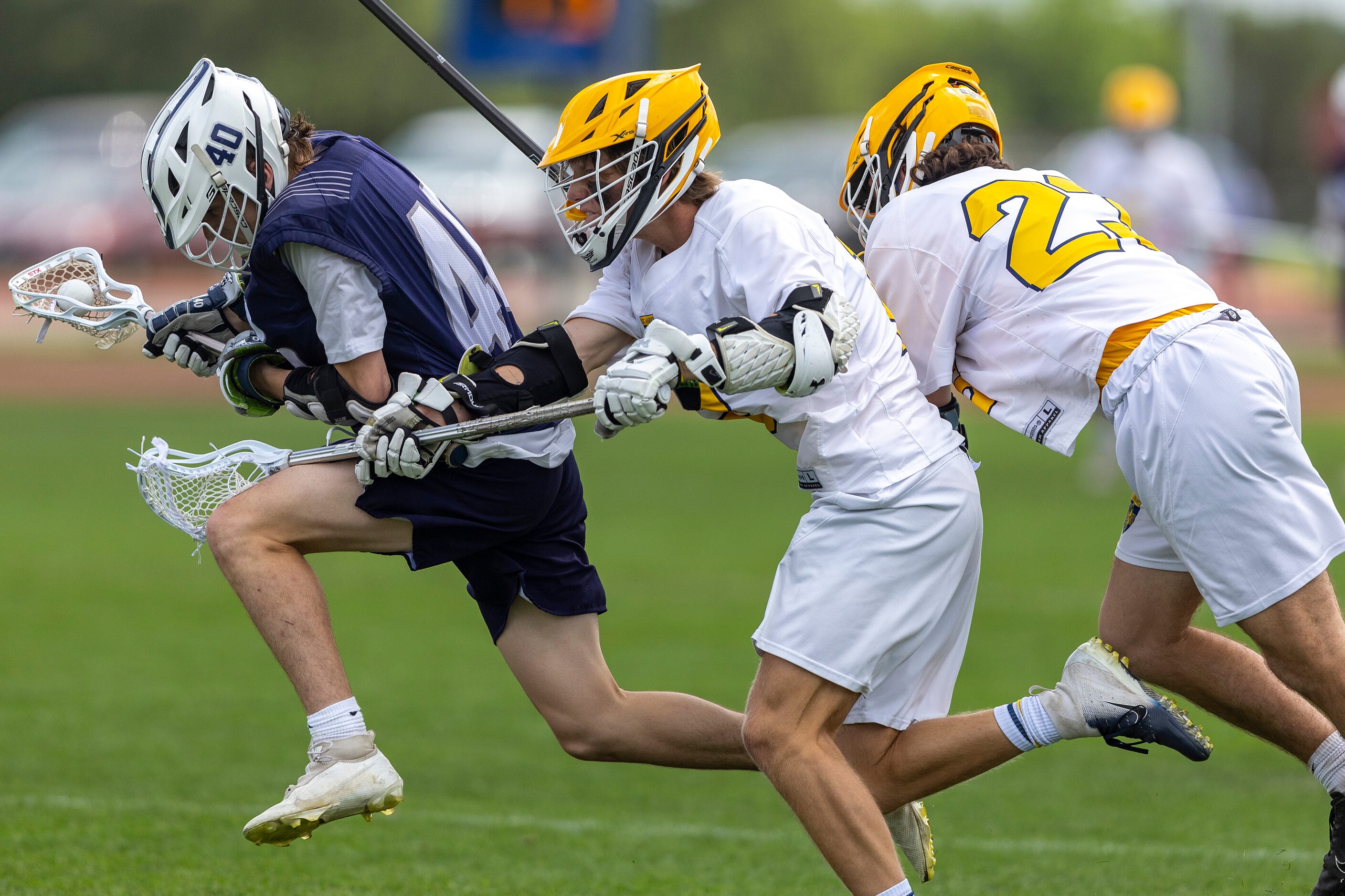 Episcopal School of Dallas’ Cooper Raney, left, drives past St. Mark's Henry Boykin and...