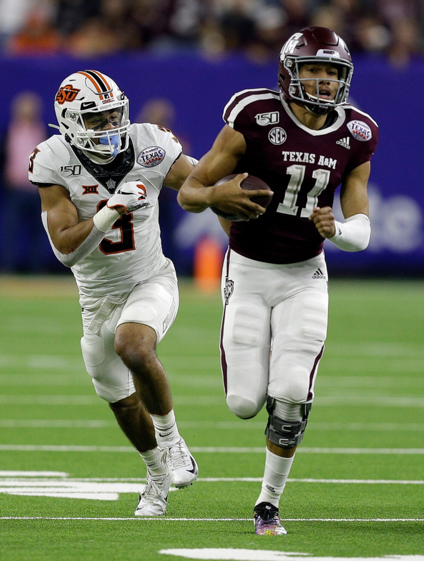 HOUSTON, TEXAS - DECEMBER 27: Kellen Mond #11 of the Texas A&M Aggies runs for 66 yards as...