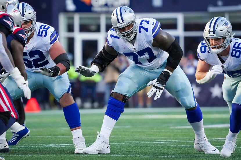 Dallas Cowboys offensive tackle Tyron Smith (77) sets up between guard Connor Williams (52)...