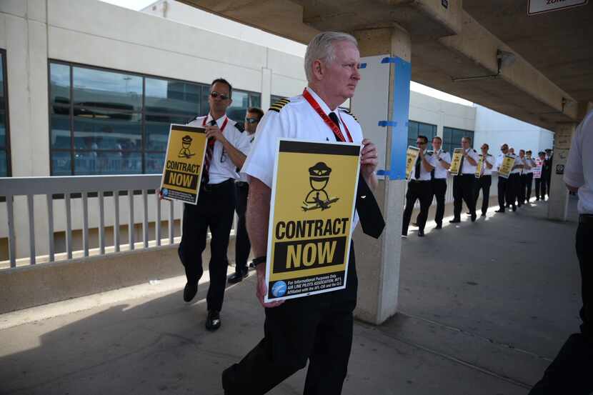 Spirit Airlines pilots and members of the Air Line Pilots Association, International, picket...