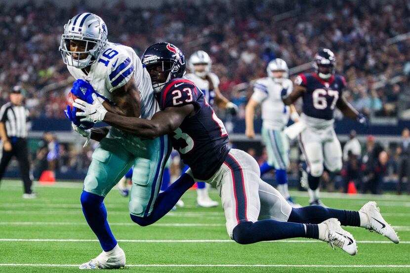 Dallas Cowboys wide receiver Ced Wilson (16) is tackled by Houston Texans defensive back...