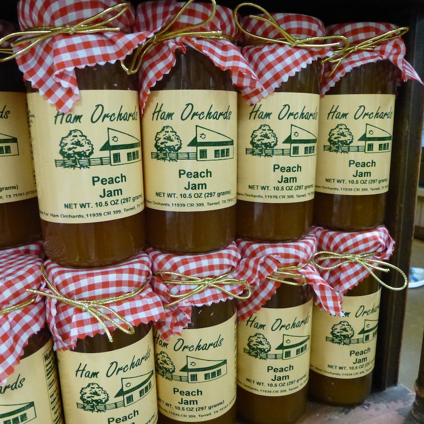 Ham Orchards stocks shelf after shelf of custom-jarred products, from ghost pepper salsa and...