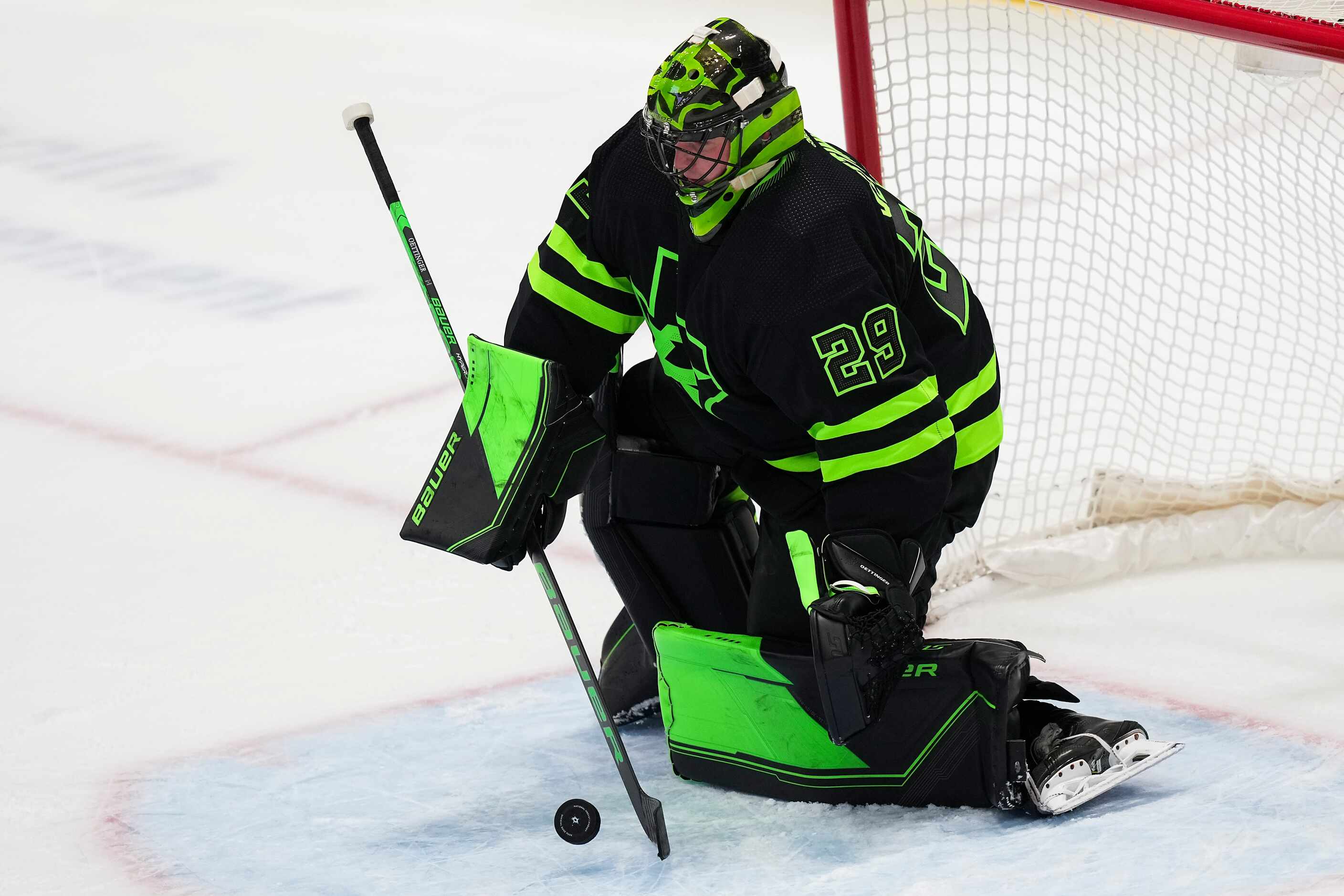 Dallas Stars goaltender Jake Oettinger (29) turns away a shot during the third period of an...