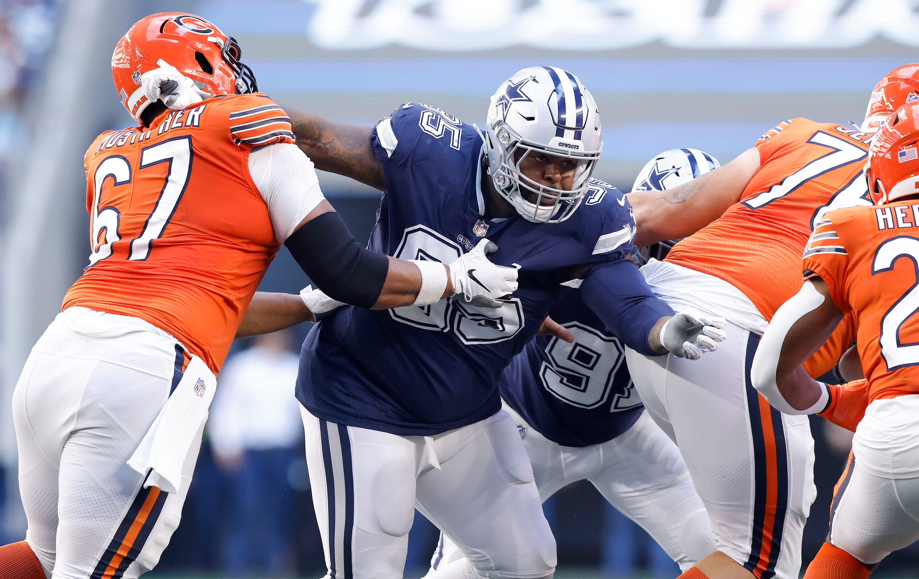 Dallas Cowboys defensive tackle Johnathan Hankins (95) eyes a run play as he goes up against...