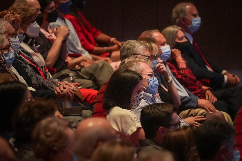 Guests watch a video of former President George W. Bush’s speech at Shanksville, Pa., which...