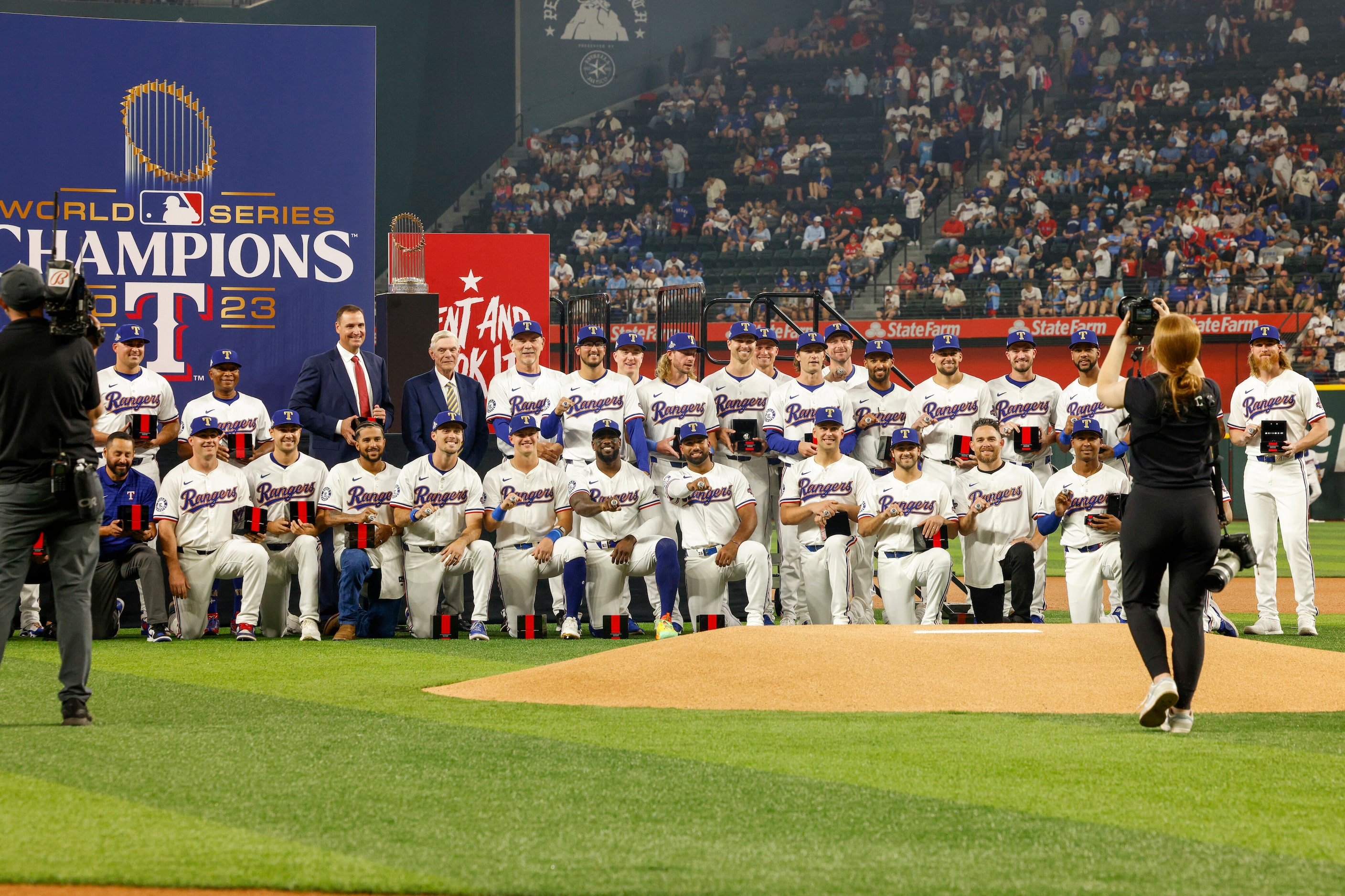 Members of the Texas Rangers World Series championship team pose for a photo after receiving...