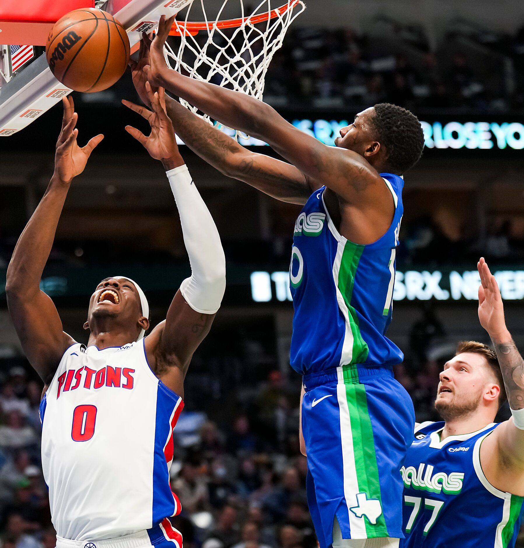 Detroit Pistons center Jalen Duren (0) has the ball knocked away by Dallas Mavericks forward...