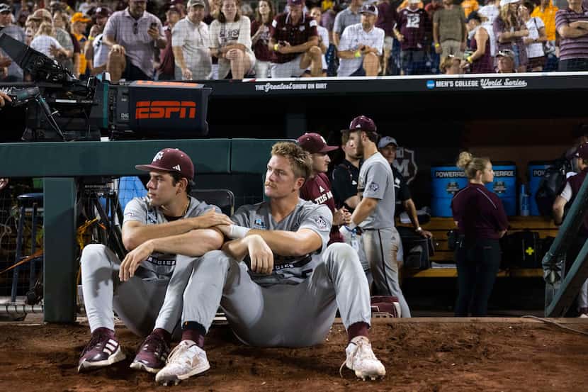 Texas A&M's Ryan Prager, right, sits with Hayden Schott as they watch Tennessee celebrate...