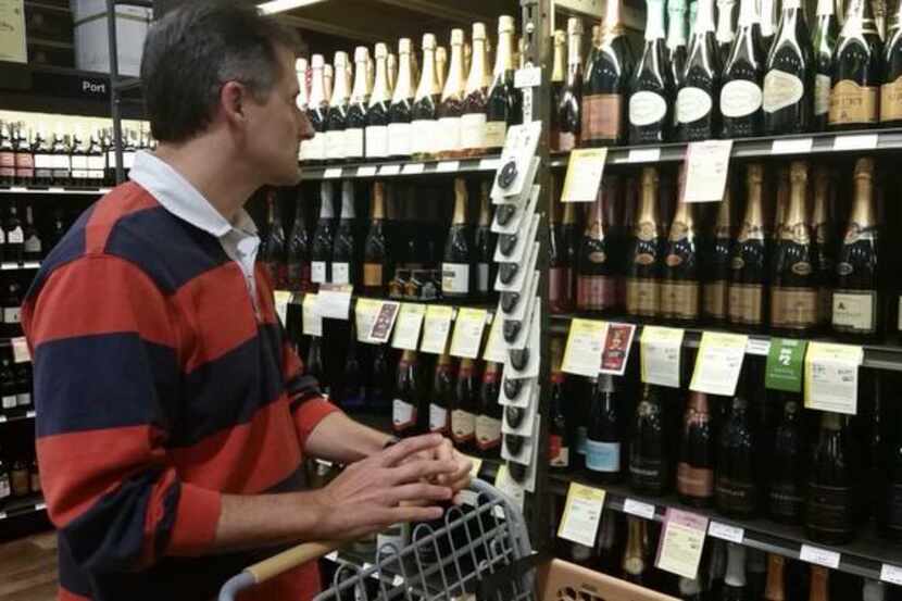 
Adrian Bird of Coppell shops for sparkling wine at Total Wine and More in Lewisville. The...