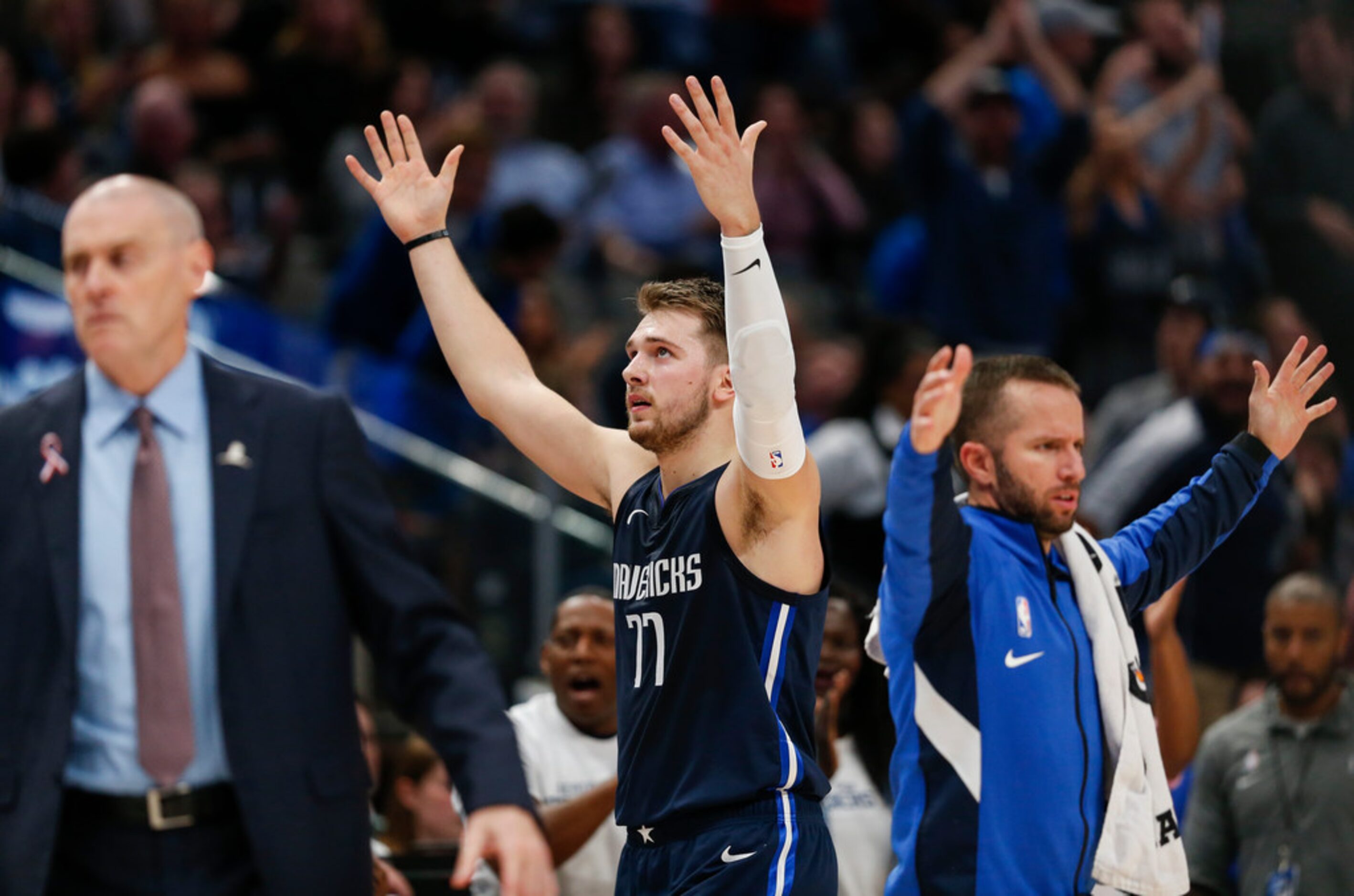 Dallas Mavericks guard Luka Doncic (77) celebrates a play during the third quarter of an NBA...