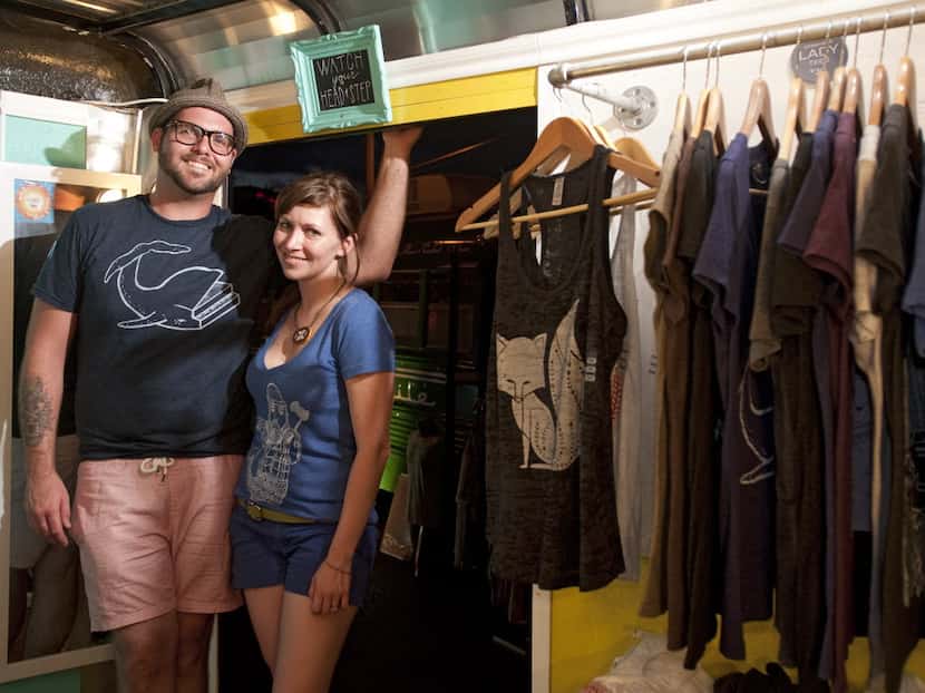 Dylan Dowdy and wife Pamela Dowdy stand inside the Dowdy Studio Wagon, their mobile clothing...