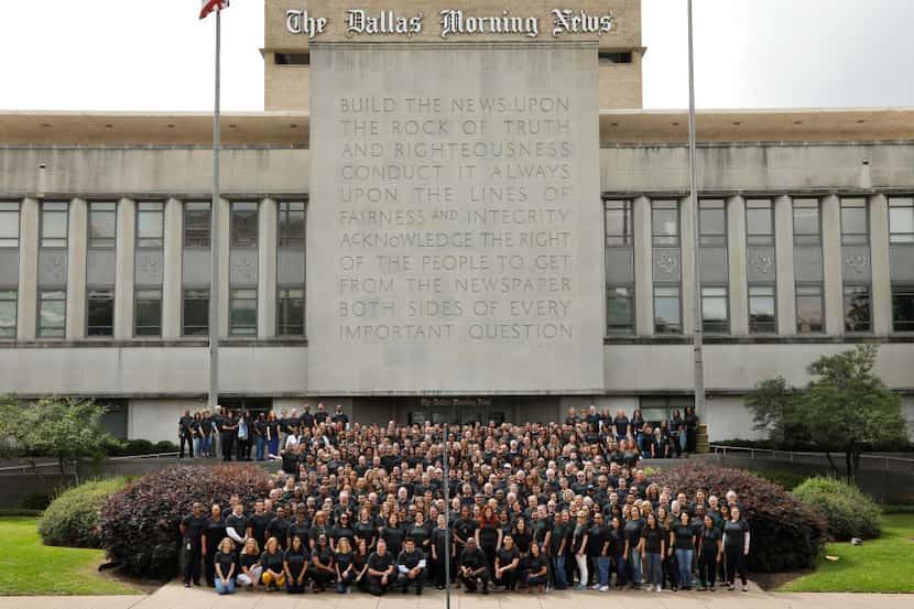 The Dallas Morning News staff group photo in front of the Rock of Truth, photographed April...