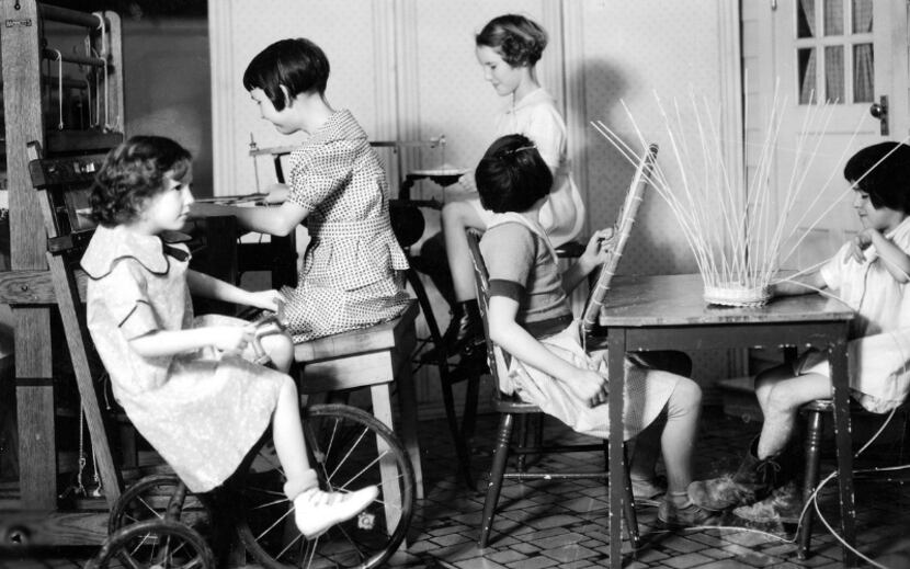 A black and white image of children being treated by nurses at Scottish Rite for Children.