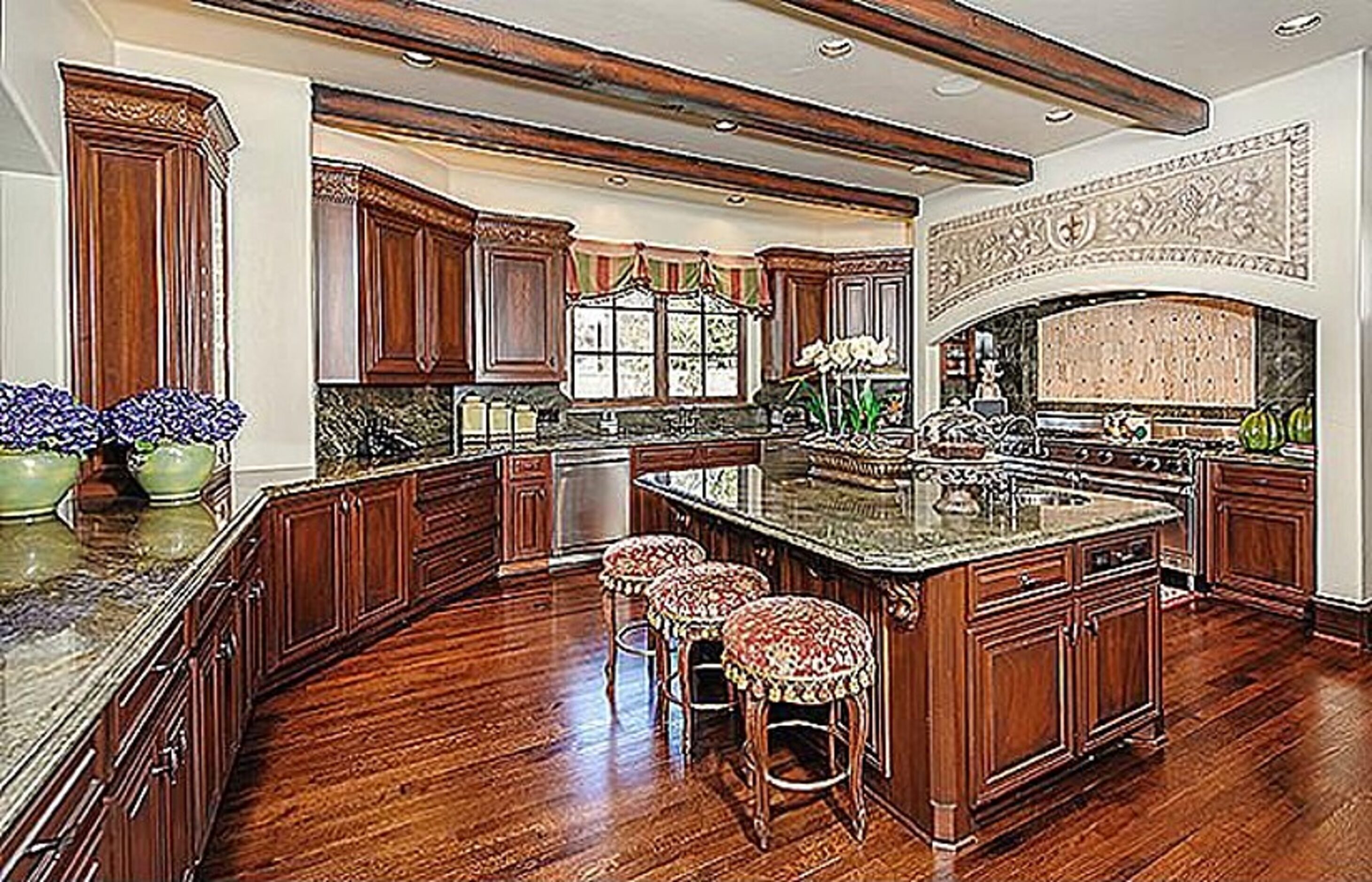 The home features a hardwood and marble kitchen with premieum appliances. 