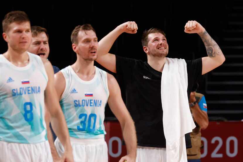 Slovenia’s Luka Doncic (77) celebrates after a made basket as they play Germany during the...