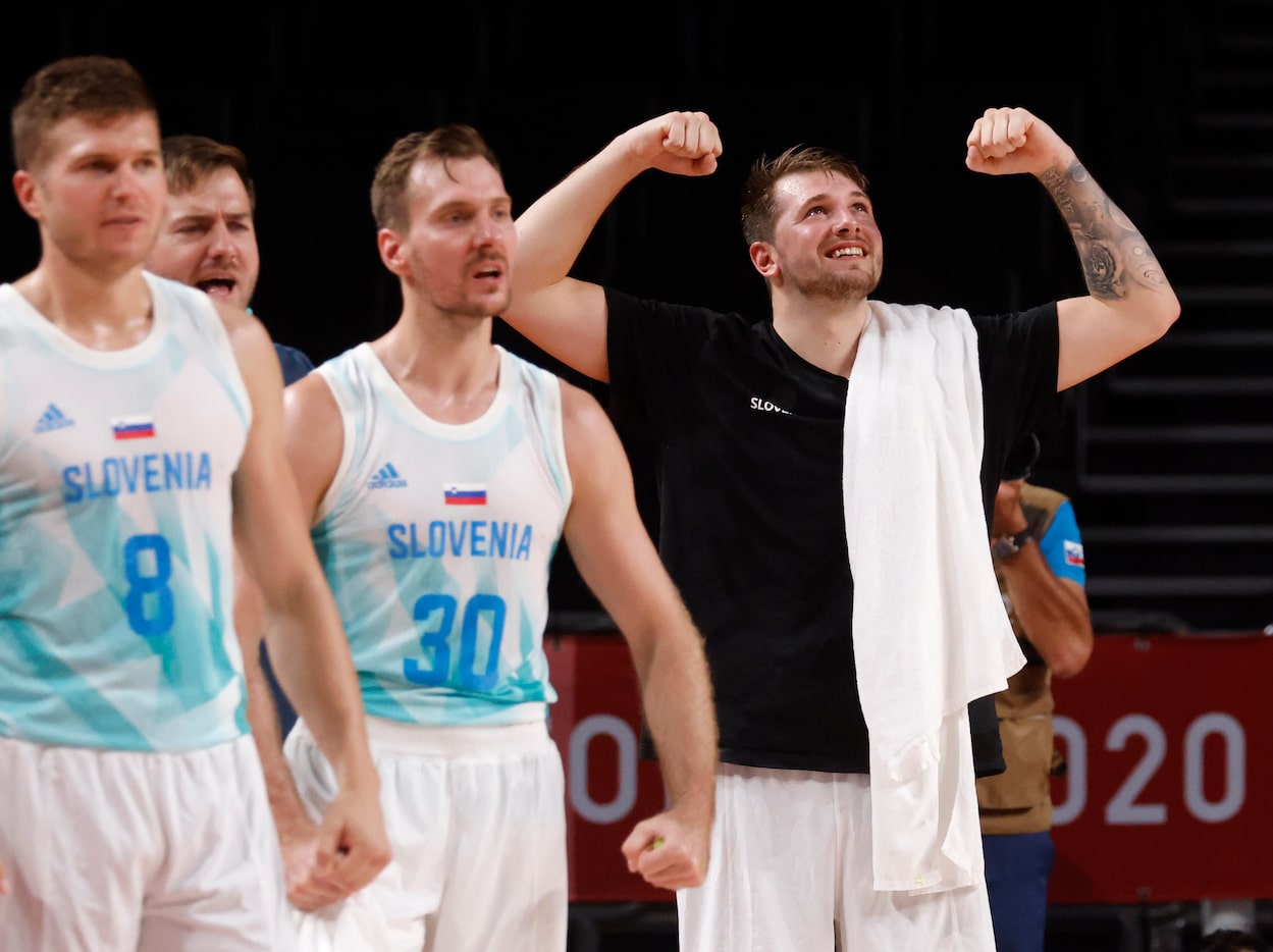 Slovenia’s Luka Doncic (77) celebrates after a made basket as they play Germany during the...