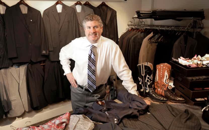Bob Baumann shows off some of the items available at his Addison menswear store, Edward...