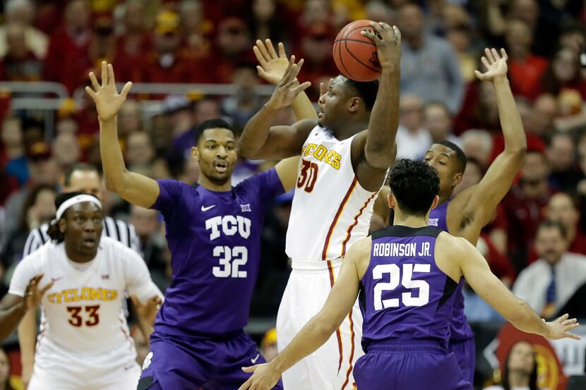 KANSAS CITY, MO - MARCH 10:  Deonte Burton #30 of the Iowa State Cyclones passes bahind his...