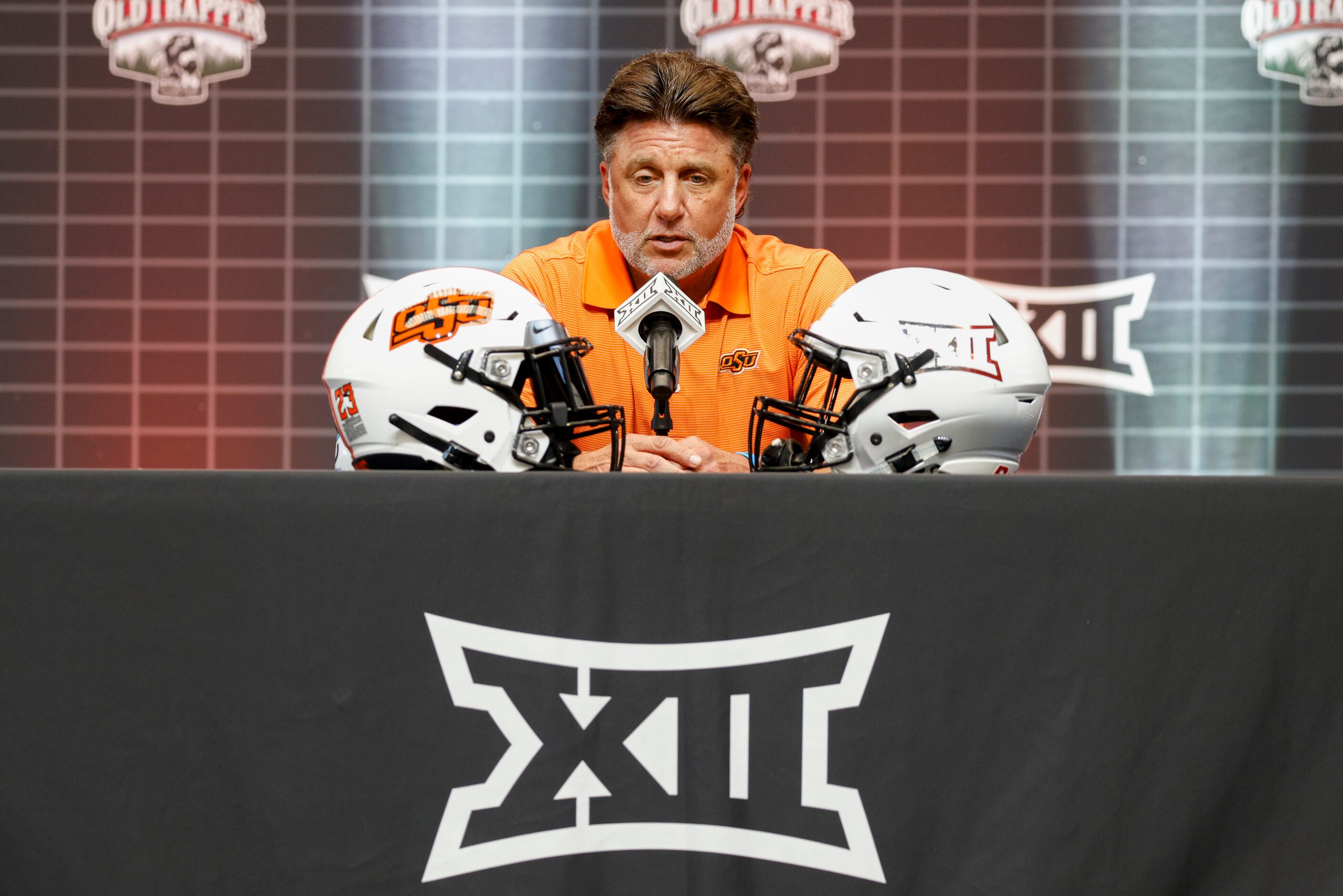 Oklahoma State head coach Mike Gundy speaks during the Big 12 Media Days at AT&T Stadium,...