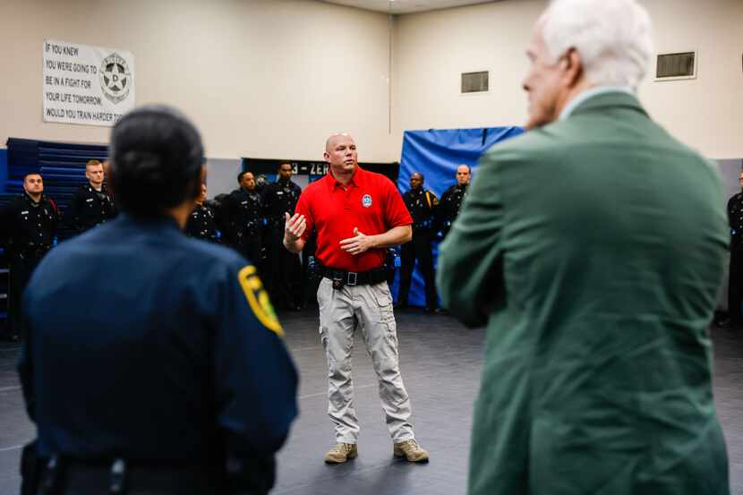 Senior Cpl. Harry Blust talks during a demonstration about de-escalation training for...