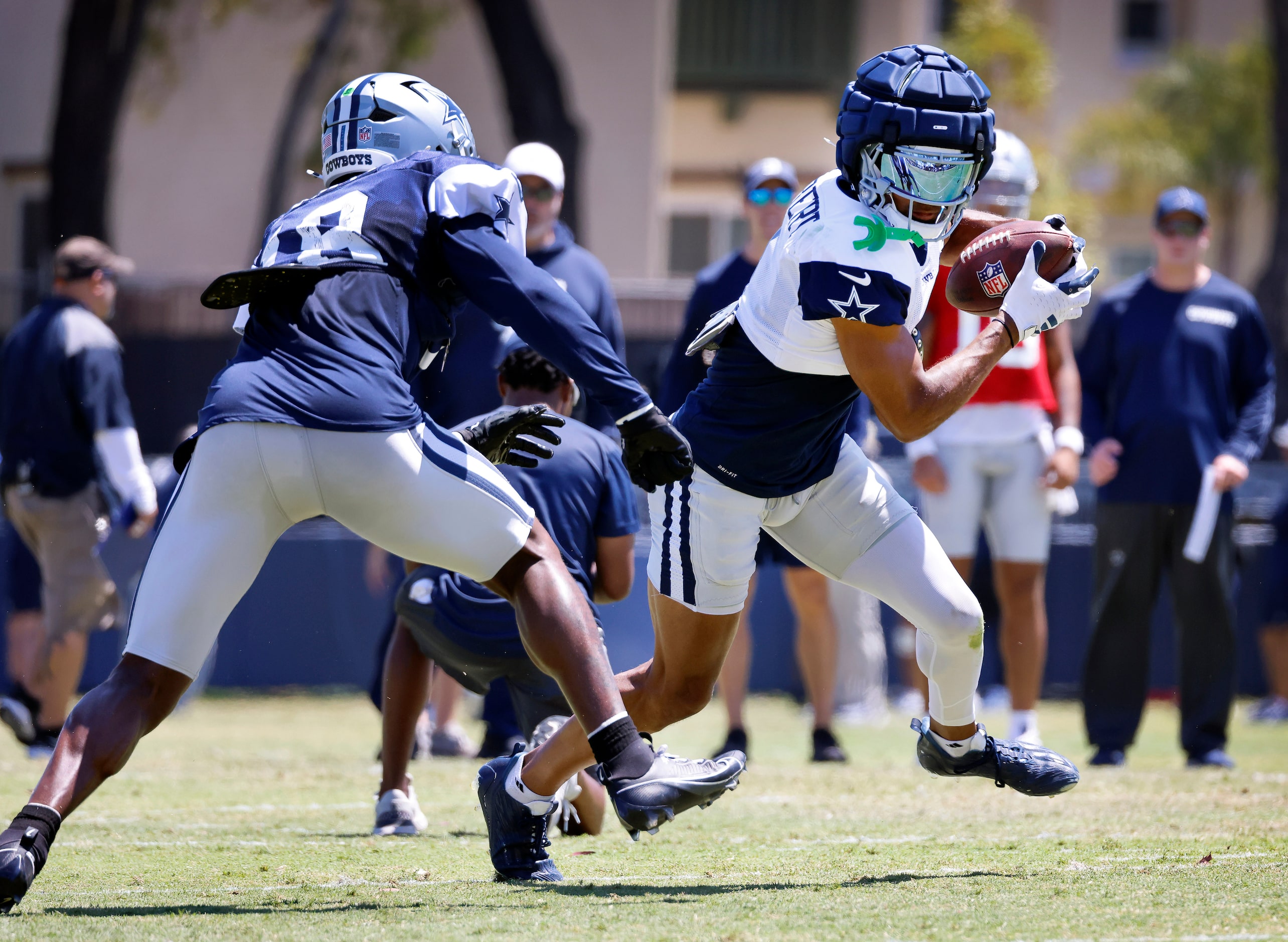  Dallas Cowboys wide receiver Jalen Tolbert (1) turns up field and eyes linebacker Damone...