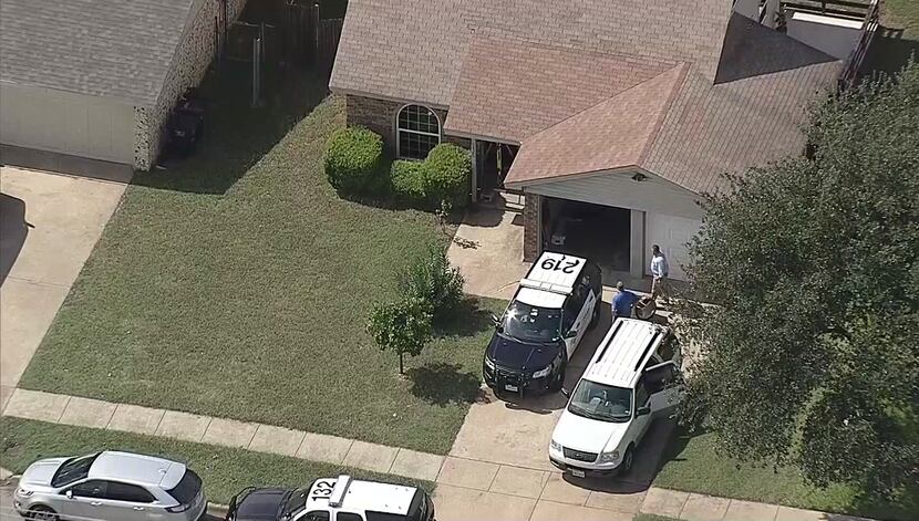 Police investigate a body found at a house in the 6400 block of Woodway Drive in Fort Worth.