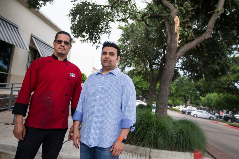 Lowkey Poke Joint owner Sam Handa, right, and chef Jose Araujo lifted a tree off a car after...