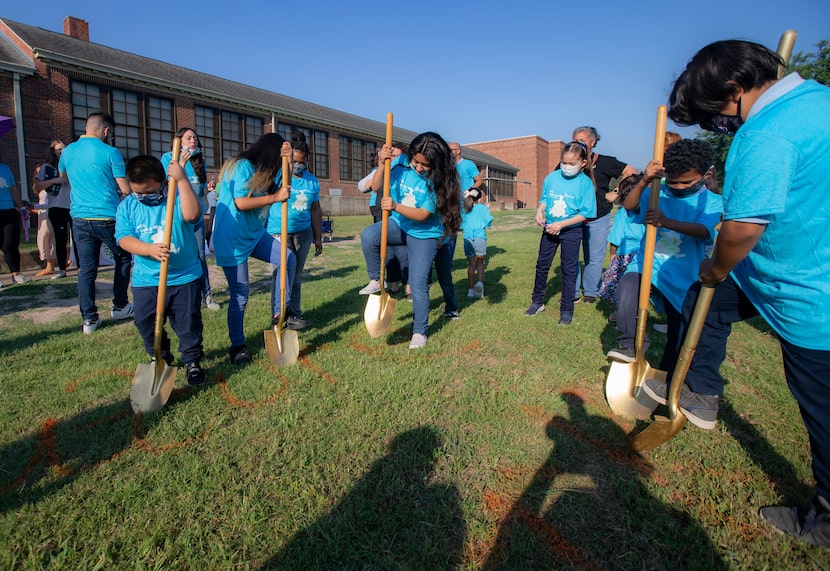  Leila P. Cowart Elementary School students participate in a Texas Trees Foundation ground...