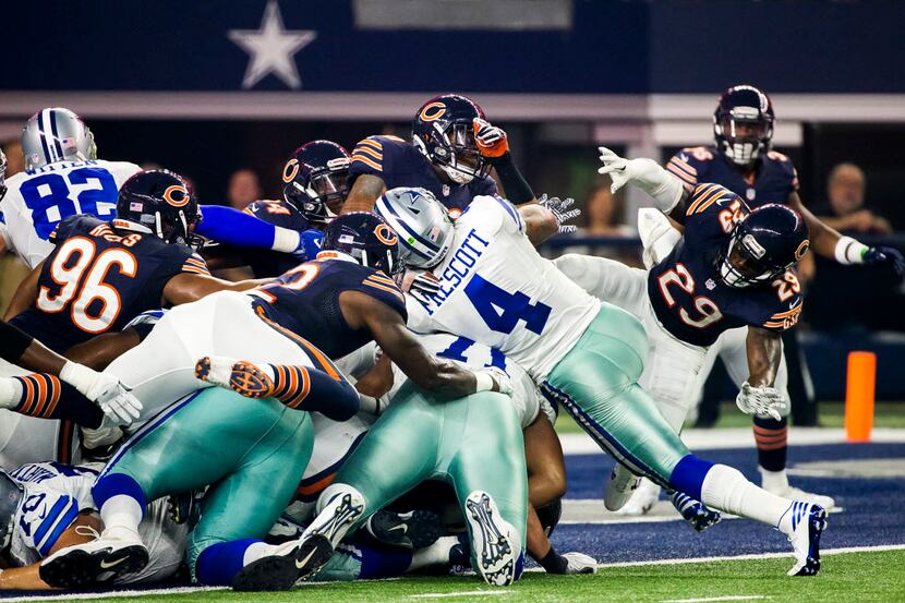 Dallas Cowboys quarterback Dak Prescott (4) pushes into the end zone on a 1-yard touchdown...