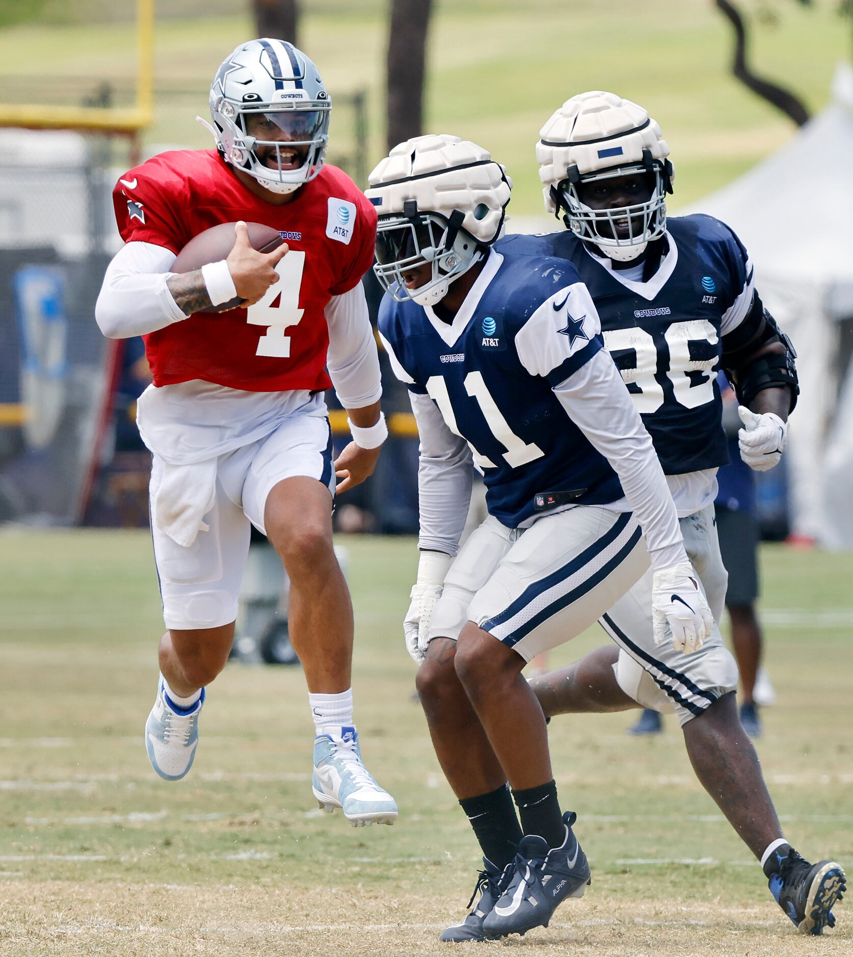 Dallas Cowboys quarterback Dak Prescott (4) is tagged by outside linebacker Micah Parsons...