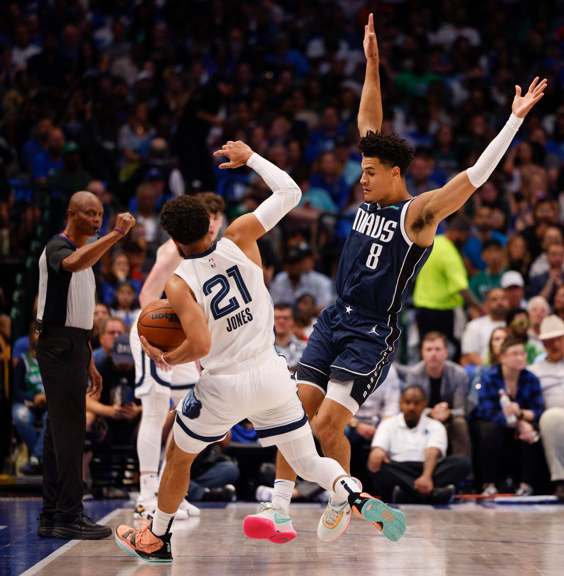 Dallas Mavericks guard Josh Green (8) fouls Memphis Grizzlies guard Tyus Jones (21) during...