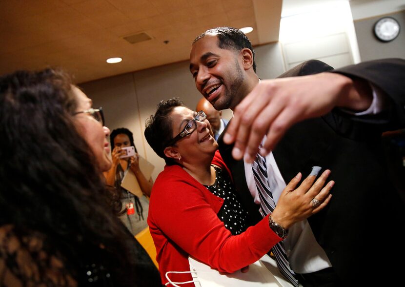 Quintin Lee Alonzo hugged his aunt, Joanne Alonzo-Gloria (center), and reached to hug his...