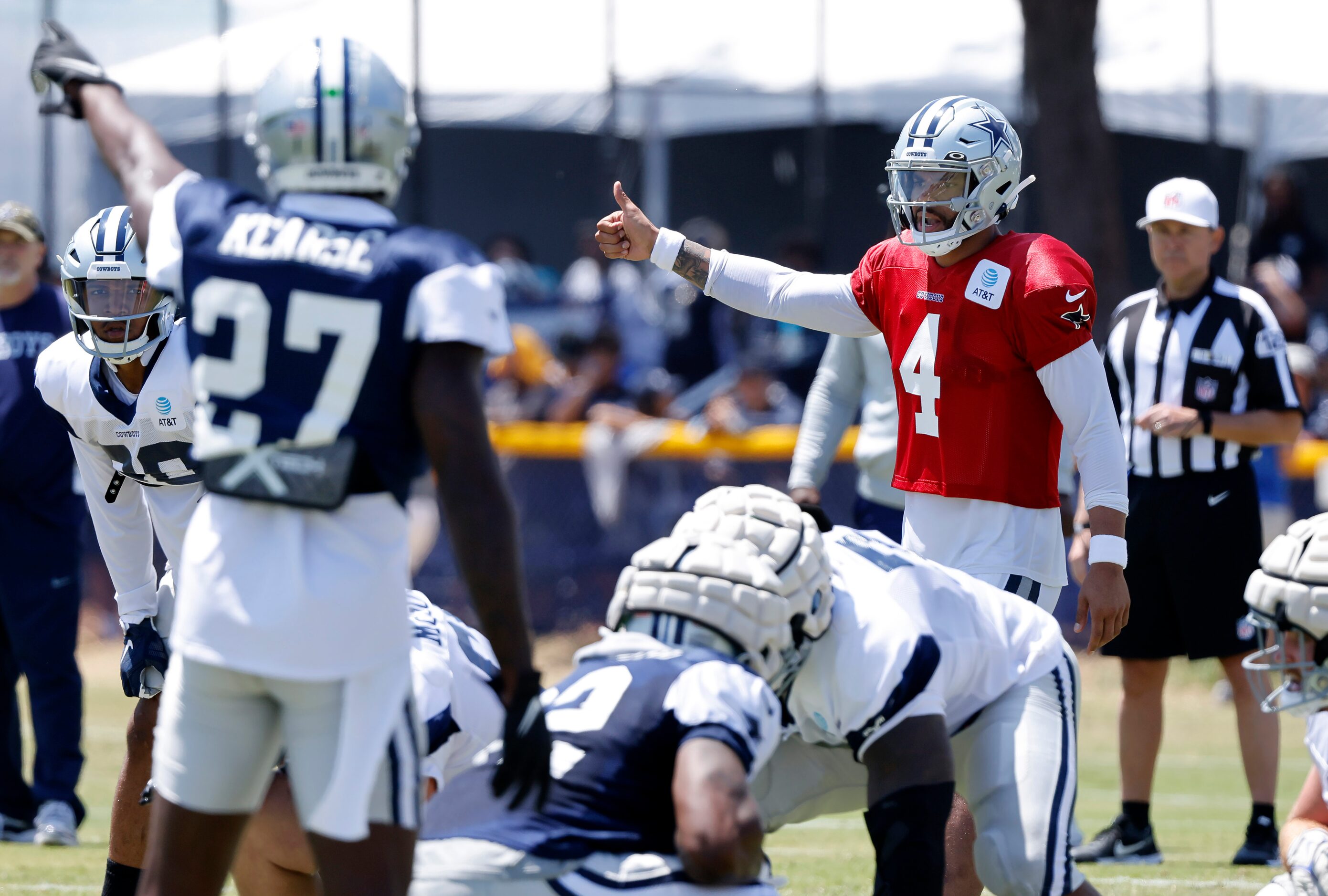 Dallas Cowboys quarterback Dak Prescott (4) calls a play against safety Jayron Kearse (27)...