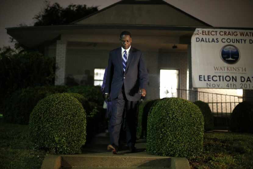 Dallas County District Attorney Craig Watkins walks out of his campaign headquarters to...