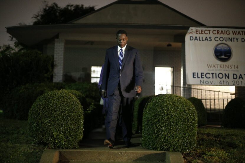 Dallas County District Attorney Craig Watkins walks out of his campaign headquarters to...