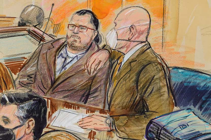 FILE - This artist sketch depicts Guy Wesley Reffitt, joined by his lawyer William Welch,...